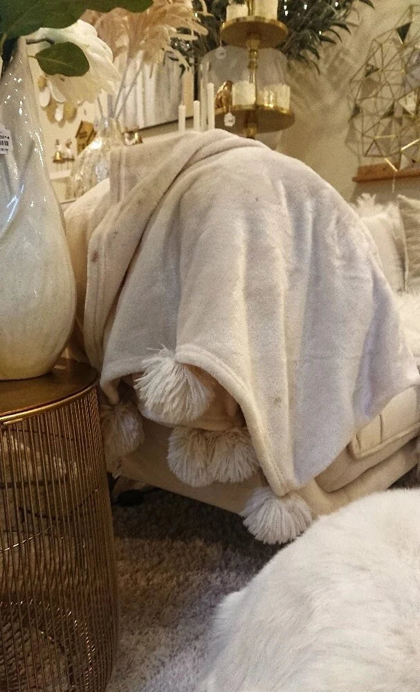 Wohndecke uni Creme mit Pompons